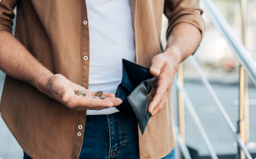 A man with a coins in his hand